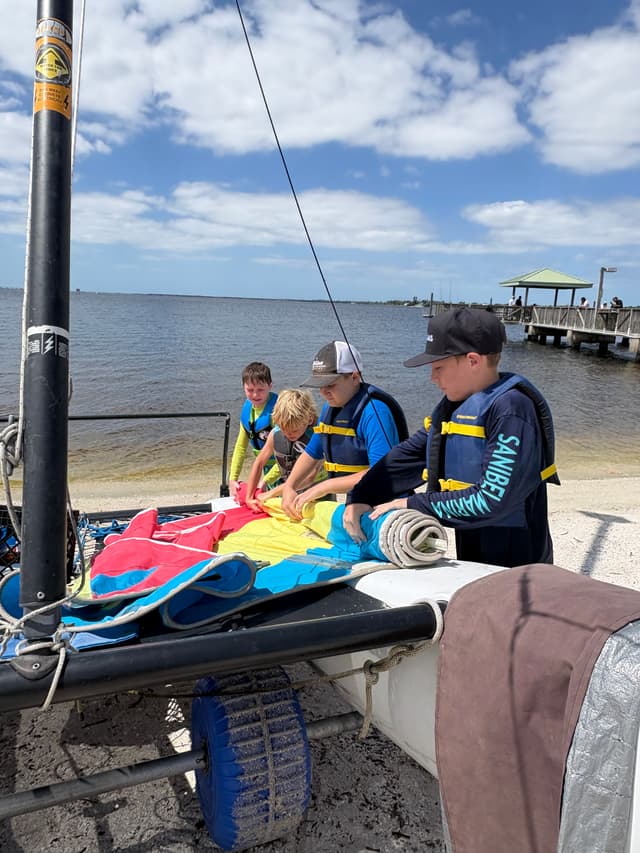 Young sailor taking responsibility for their boat