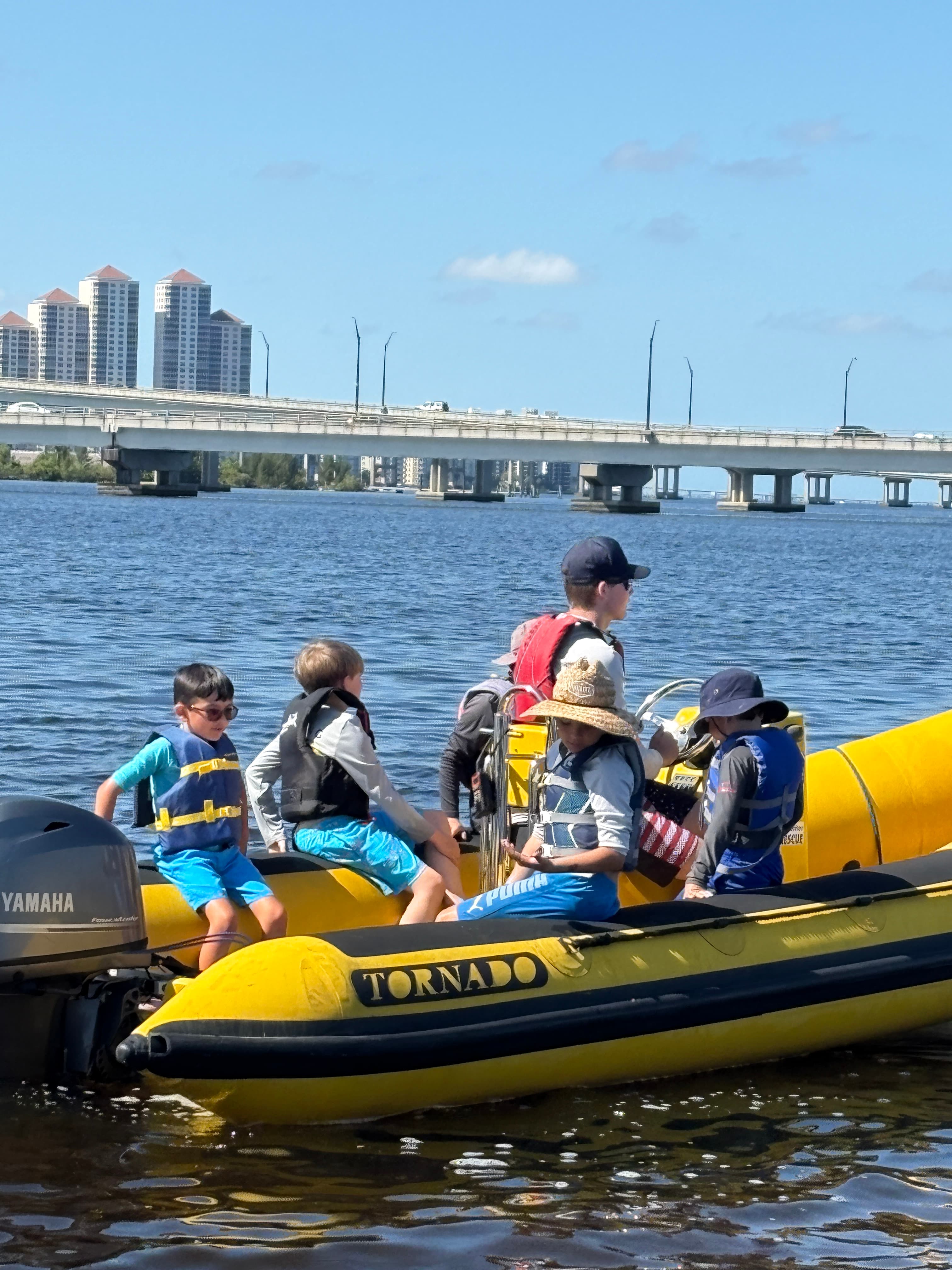 Students learning powerboat handling on the water