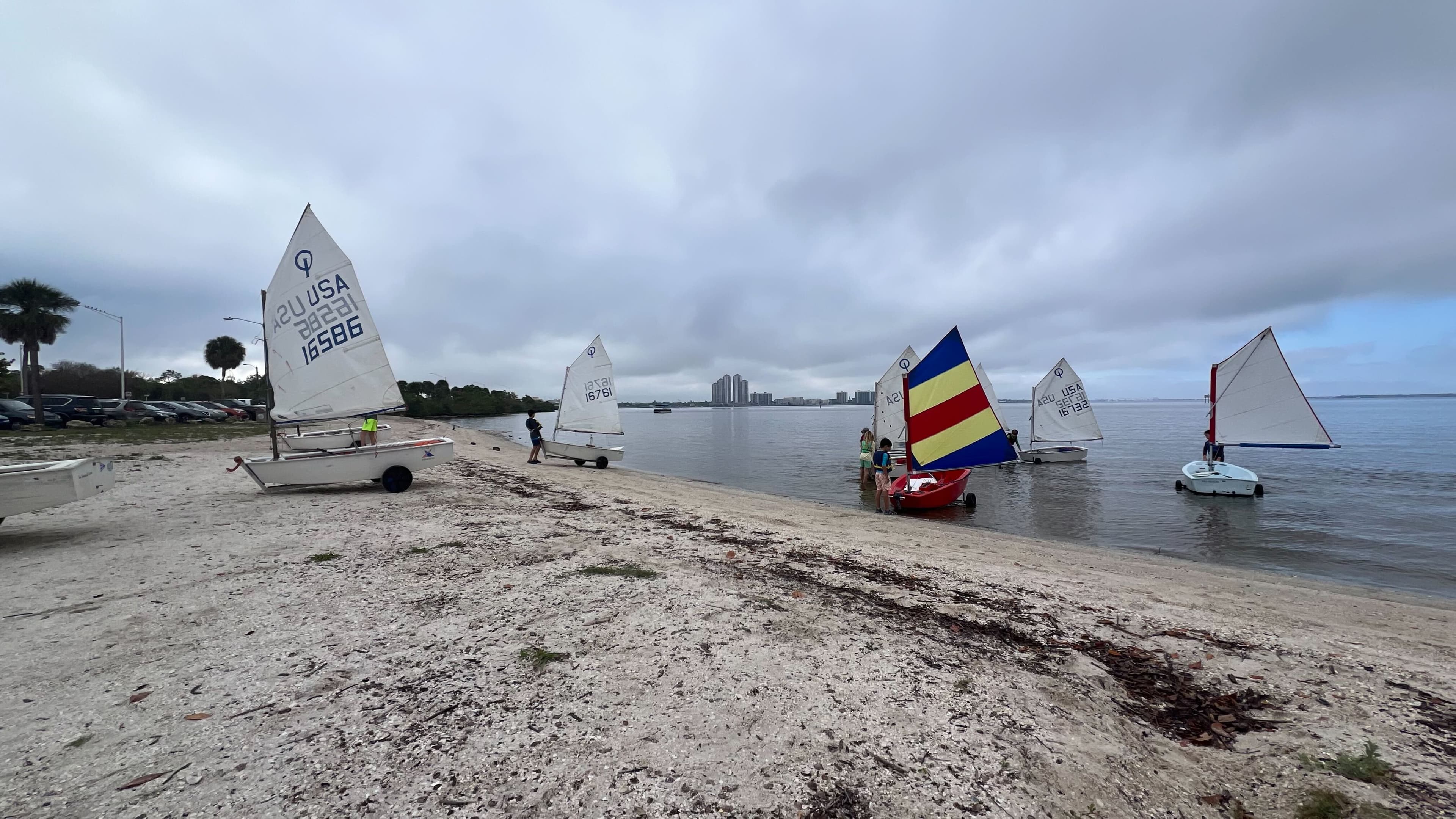 Fleet of sailboats entering the water
