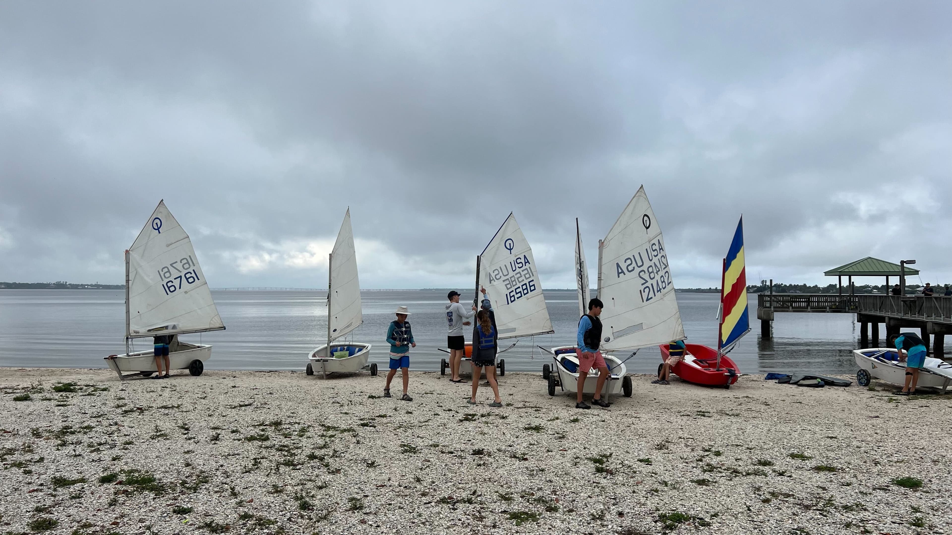Youth sailors preparing boats for launch