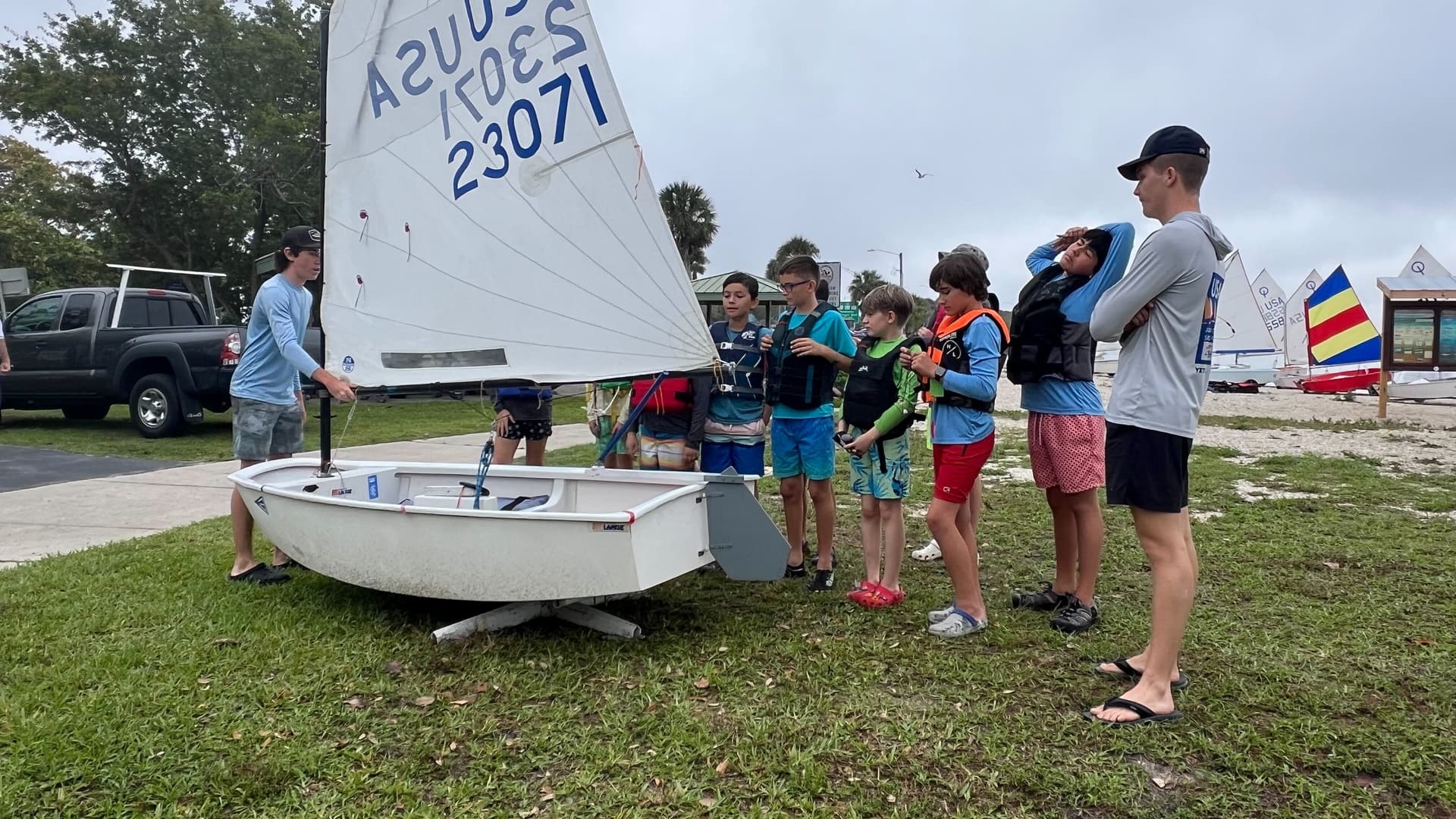 Instructor teaching kids to sail