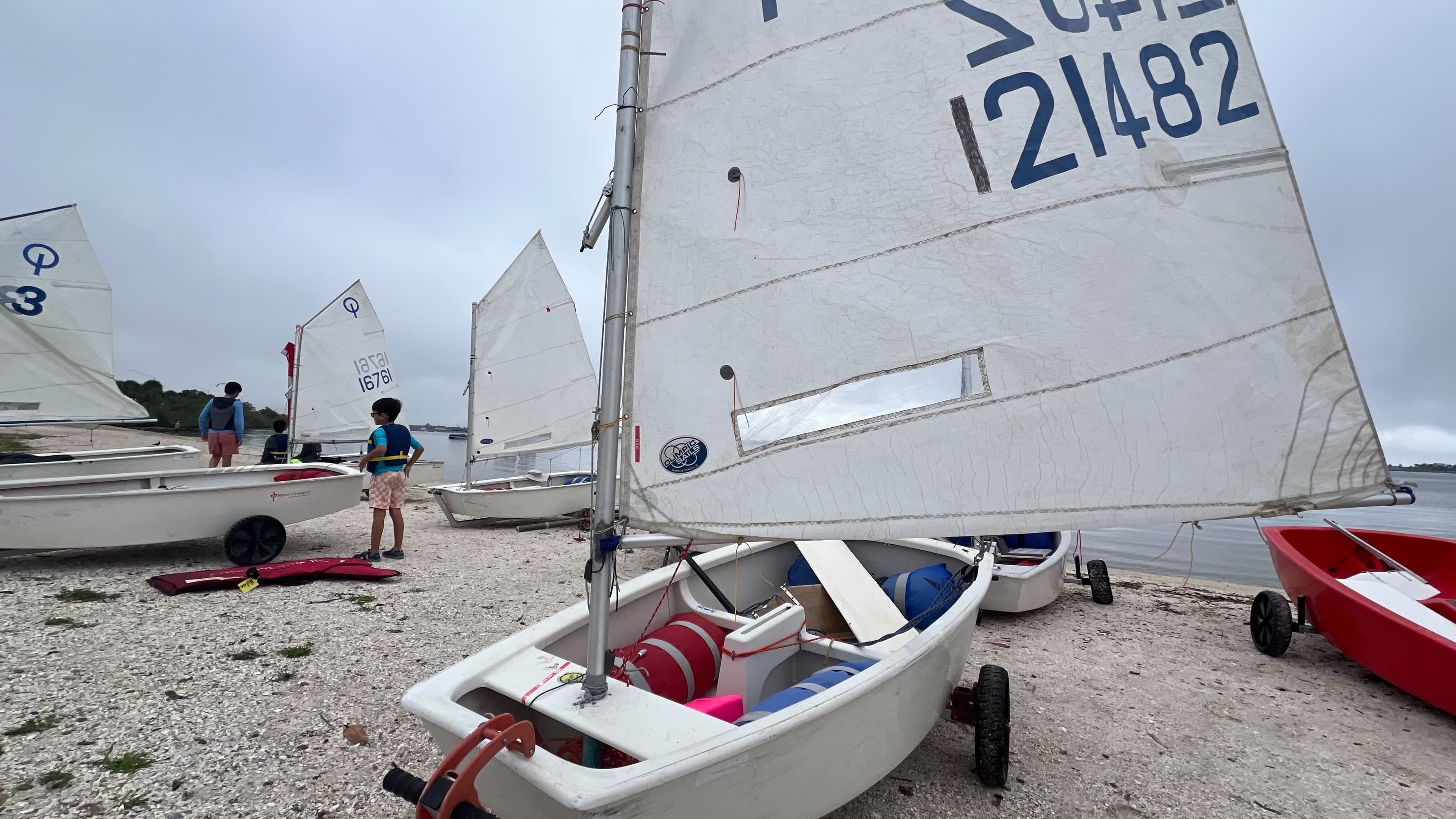 Close-up low angle view of an Optimist sailboat