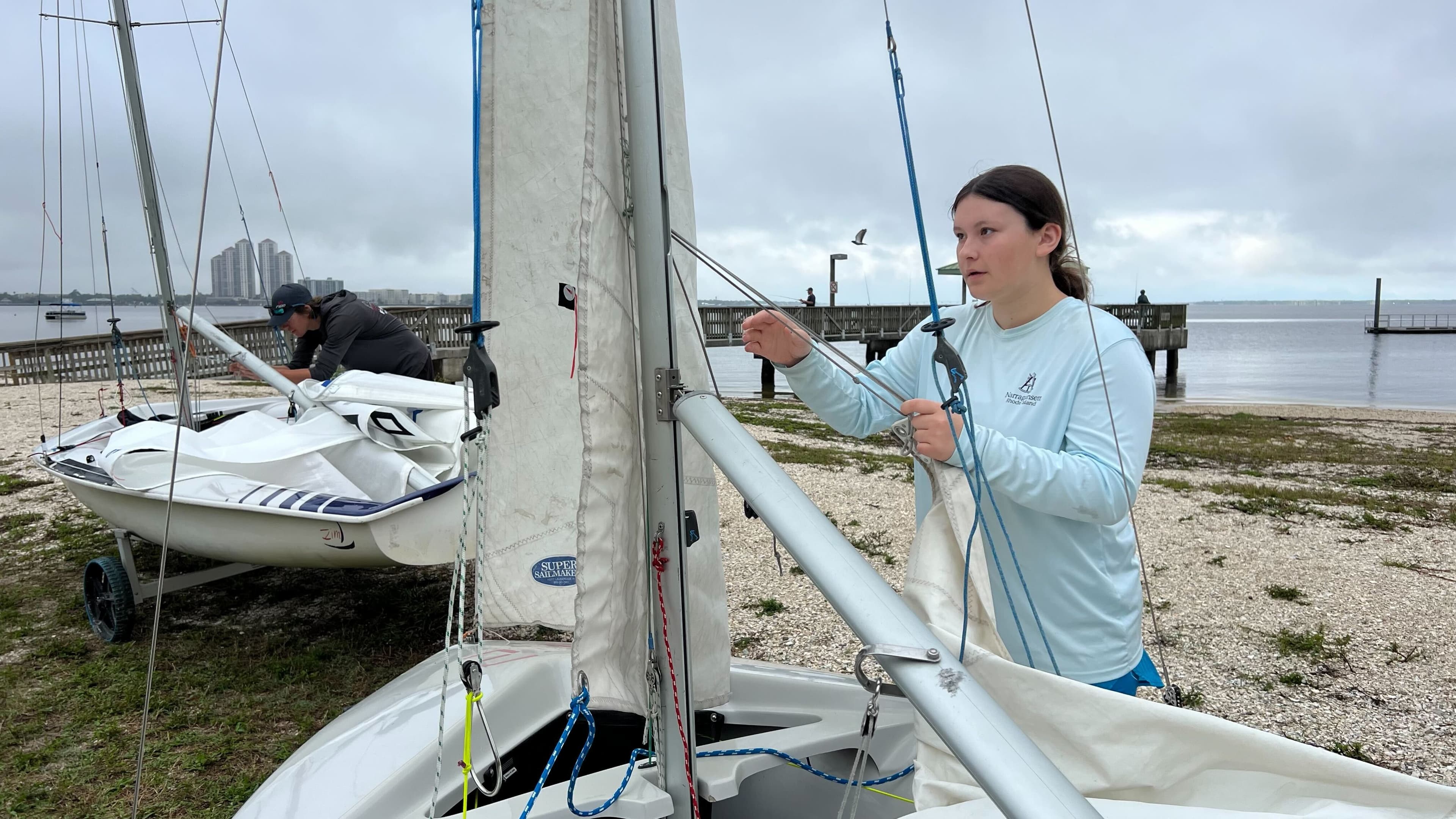 Close-up of a teen rigging a sailboat