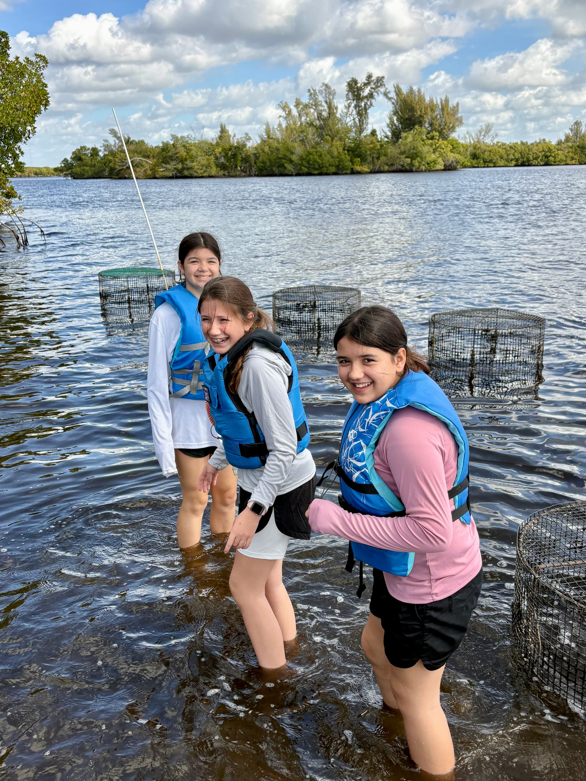 REACH program participants learning hands-on